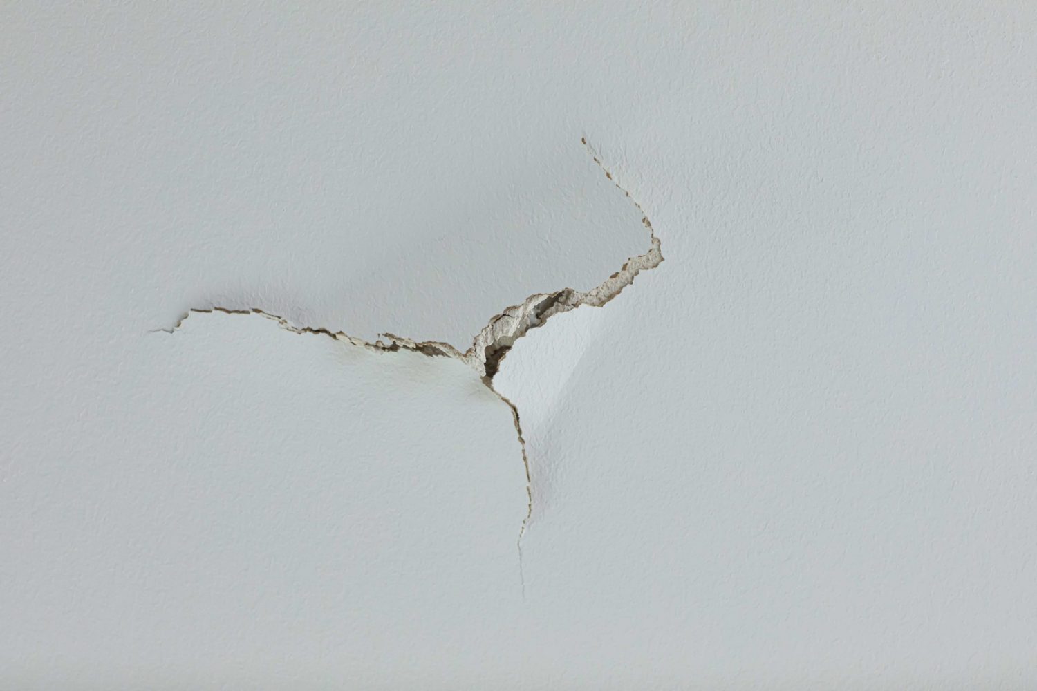 Large hole on a gyprock wall in a house